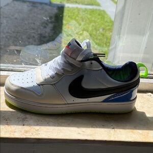Nike Kids White Sneaker with Black Swoosh, Blue Heel and Neon Green Accents